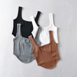 Flat lay of ribbed square neck tank tops in black, white, gray and burgundy colors