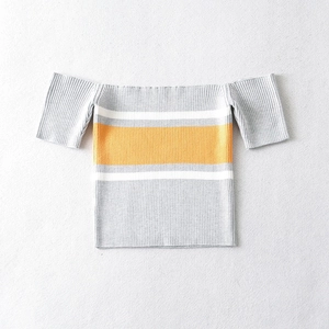 Close-up of ribbed knit texture on off-the-shoulder striped crop top with grey and yellow