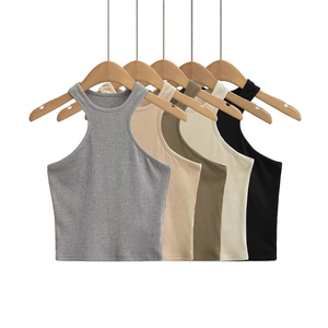 Detailed macro view showing five neutral colors of ribbed knit halter tank tops hanging