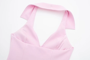 Detail view of pink halter top with shirt collar and high-quality woven fabric texture
