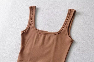 Close-up of brown ribbed knit corset top showing square neck and vertical texture detail