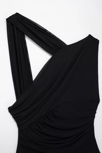 Detail of asymmetrical ruched black mesh fabric on a modern sleeveless bodysuit
