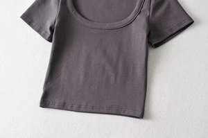 Close-up of the ribbed texture and U-neckline of this dark gray slim knit crop top