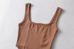 Detail of brown ribbed knit camisole featuring vertical corset-style seams and square neck