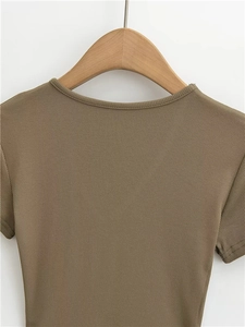 Detail of the reinforced neckline and ribbed knit texture on a coffee-colored slim T-shirt