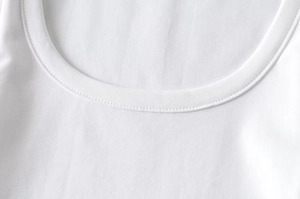 Detail of white U-neck top featuring premium vertical texture and clean stitched seams