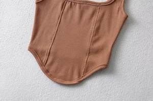Close-up of caramel ribbed knit camisole with square neck and structure stitching detail