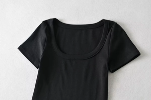 Detailed close-up showing the U-neck stitching and ribbed texture of this black crop top