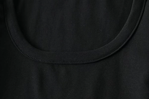 Close-up of the black scoop neckline showing premium double-stitched sewing detail