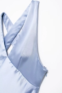 Detail of light blue satin dress showing side invisible zipper and fine stitching
