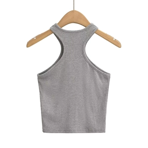 Detail showing the ribbed knit texture and refined piping on grey halter top