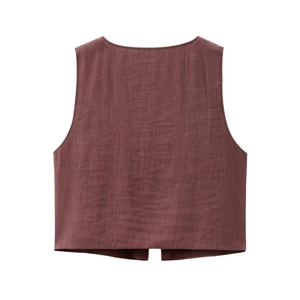 Detail of dark brown textured vest with natural crinkle fabric and sleeveless design