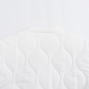 Women's white quilted fashion jacket featuring elegant gourd stitching and round neckline