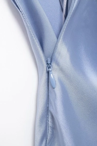 Detail of light blue satin dress featuring a high-quality invisible water-drop zipper