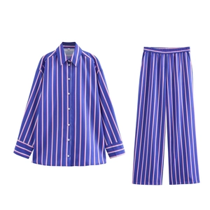 Two-piece striped set featuring a button-down shirt and loose-fitting trousers in blue