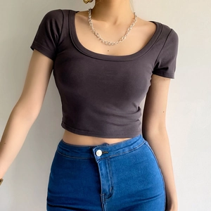 Slim fit charcoal grey cropped t-shirt with scoop neck shown on model with blue jeans