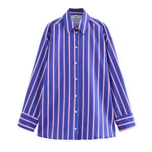 Detail of blue and pink striped shirt featuring white buttons and pointed collar