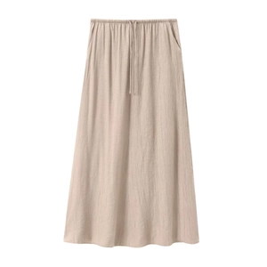Close-up of high-waist khaki midi skirt with elastic drawstring and vertical texture