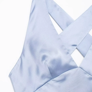 Elegant light blue satin midi dress with criss-cross neck detail and silky texture