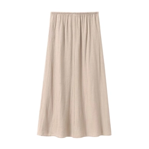 Detail of the elastic waistband and textured fabric on this apricot long A-line skirt