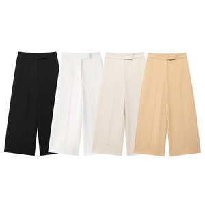 Detail view of high waisted wide leg trousers in black, white, beige and khaki colors