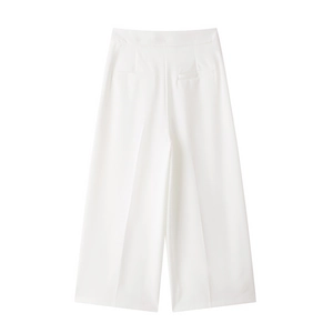 Detail of high-waisted white wide-leg trousers with professional pleated seam detail