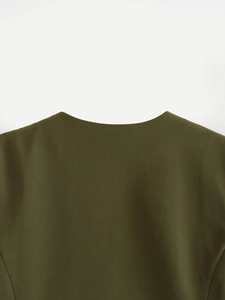 Detailed macro view of olive green twill fabric texture and high-quality seam stitching