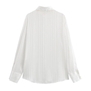 Back view of minimalist white long sleeve striped blouse with silky texture and wide cuffs