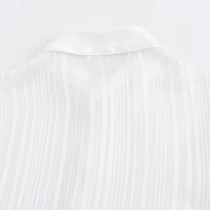 Women's white long sleeve shirt with elegant metallic vertical stripes texture detail