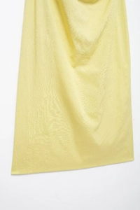 Close-up of light yellow dress fabric with high-quality plain weave and soft drape
