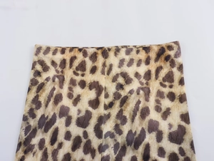 Detailed close-up of high-elastic waist seam on women's leopard print cycling leggings