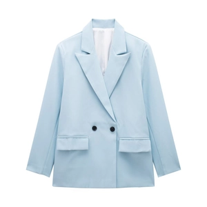 Close-up of light blue double-breasted blazer showing lapels and black buttons