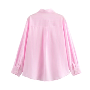 Detail view of pink and white striped shirt back with inverted pleat and cotton texture