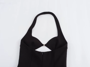 Close-up of halter neck dress with heart neckline and silver buckle detail