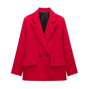 Detailed view of red double-breasted women's blazer with black buttons and peak lapels