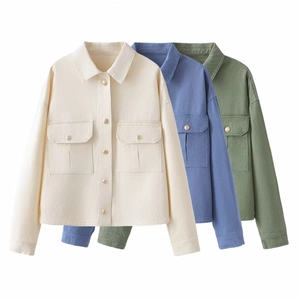 Three cropped denim jackets in beige, indigo, and green with front flap pockets