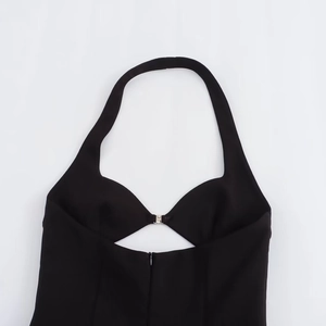 Women's black halter neck dress with deep V-cutout and decorative silver metal buckle