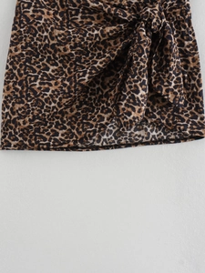 Detail of trendy leopard print cotton wrap skirt with a stylish side tie-up knot feature