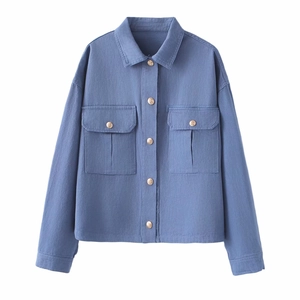 Women's vintage blue washed denim jacket with gold buttons and front chest pockets