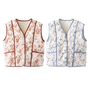 Detail of floral quilted vests showing V-neckline, white buttons and side pockets