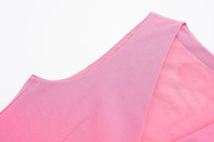 Close-up detail of pink linen-blend top featuring precise stitching and high-quality fabric