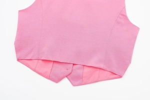 Detailed close-up showing the pink vest hem stitching and high-quality fabric lining
