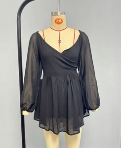 Detailed view of black V-neck wrap dress with cinched waist and long off-shoulder sleeves