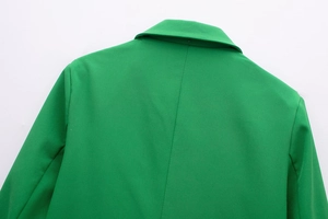 Detail of the bright green blazer collar and shoulder stitching on the back side