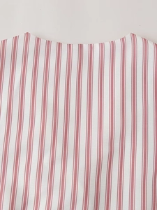 Macro view of the V-neck red and white vertical striped cotton linen fabric texture