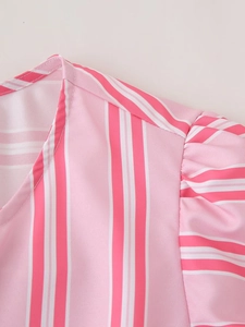 Close-up of pink striped shirt showing neckline stitching and pleated puff sleeves