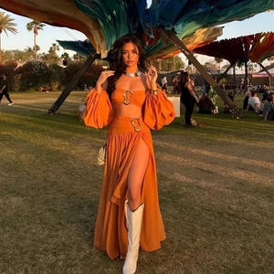 Exotic orange two-piece set with puff sleeve crop top and high slit maxi skirt