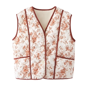 Quilted vest with brown floral print, V-neck design, button closure and red-piped pockets