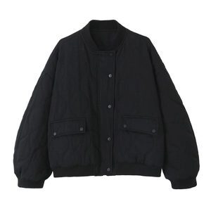Women's oversized black quilted bomber jacket with snap buttons and ribbed trim details