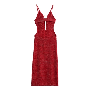 Detail of red knit midi dress featuring waist cut-outs and intricate hollow texture